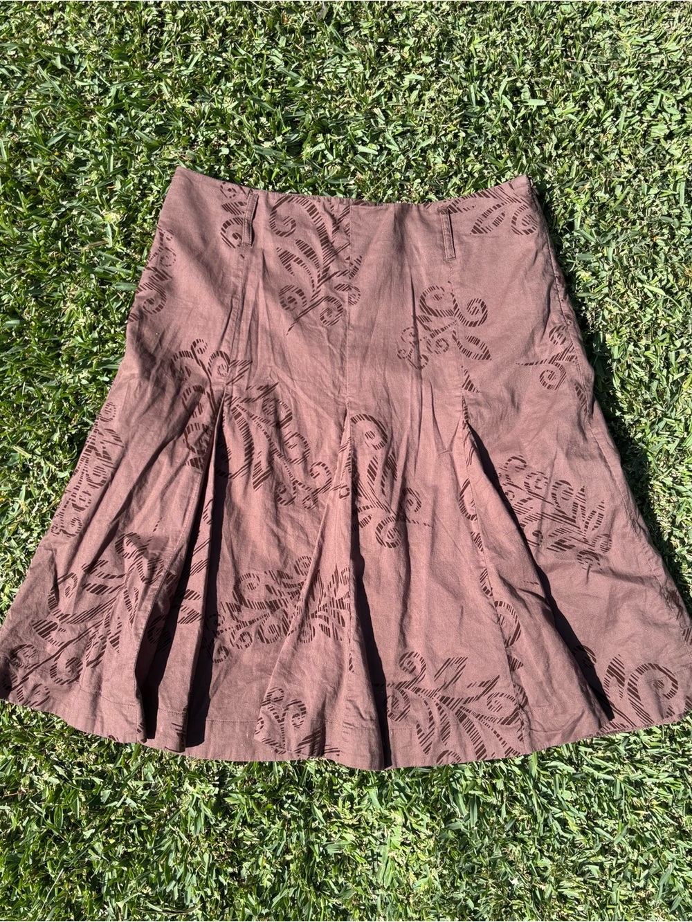Axcess brown pleated skirt with dark brown floral and scrollwork designs
